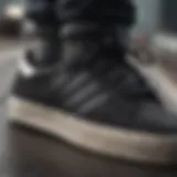 Close-up of black striped Adidas shoes showcasing their design