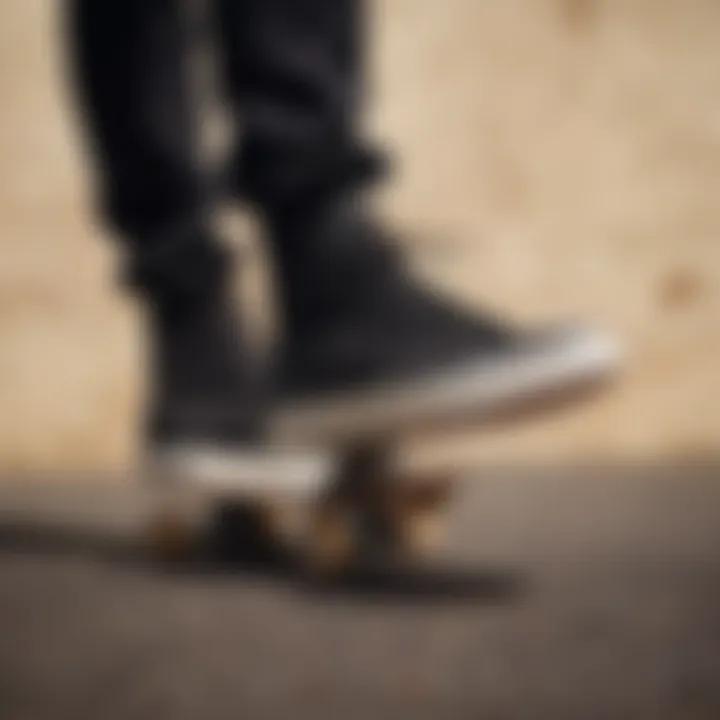 A skateboarder performing tricks while wearing black Vans with tan soles.