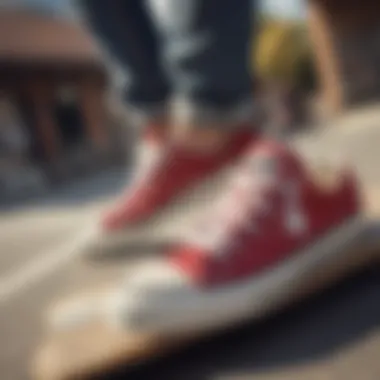 Close-up of Converse low tops on a skateboard