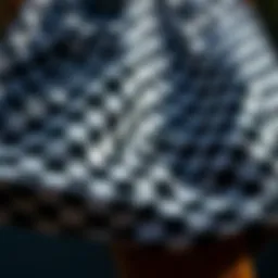 A close-up view of black and white check shorts showcasing unique fabric patterns