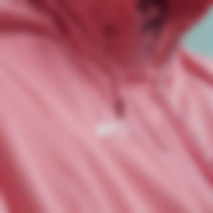 Close-up of the fabric and design details of the Nike Pink Windbreaker