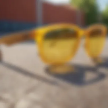 Close-up view of Ray-Ban yellow glasses resting on a skateboard