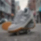 Gray New Balance shoes on a skateboard