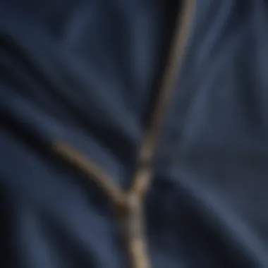 Close-up of the fabric detail on a navy blue zip-up hoodie