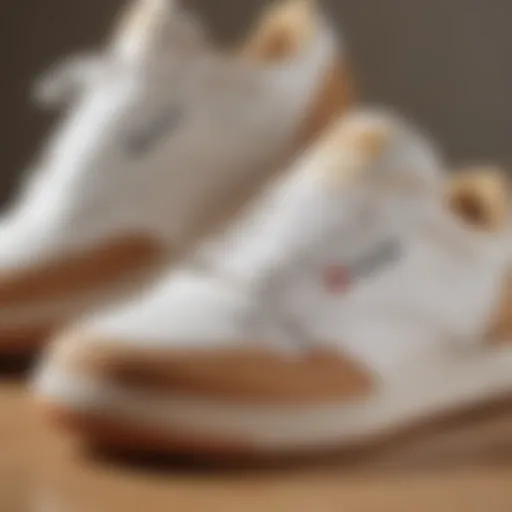 Close-up view showcasing the intricate details of Reebok white and tan shoes.