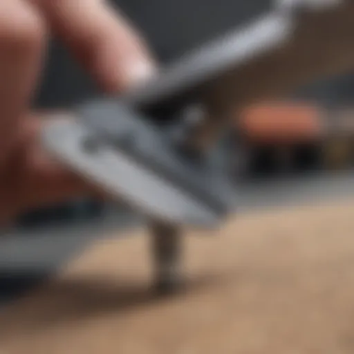 Close-up view of a skateboard bearing removal tool in action