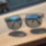 Close-up view of clear sunglasses on a skateboard deck