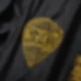 Close-up of the black and yellow Vans shirt highlighting the unique design elements